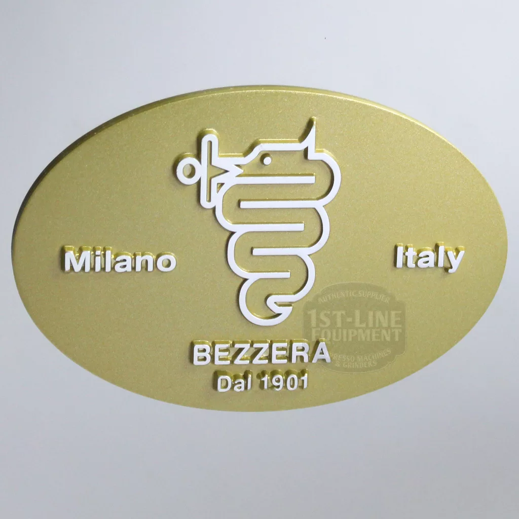 Oval gold plaque featuring a white serpent and staff, with Milano left, Italy right, and BEZZERA Dal 1901 at bottom. This exclusive badge is from the discontinued Bezzera BZ07 DE Electronic Espresso Machine. © 2025 1st-line.com