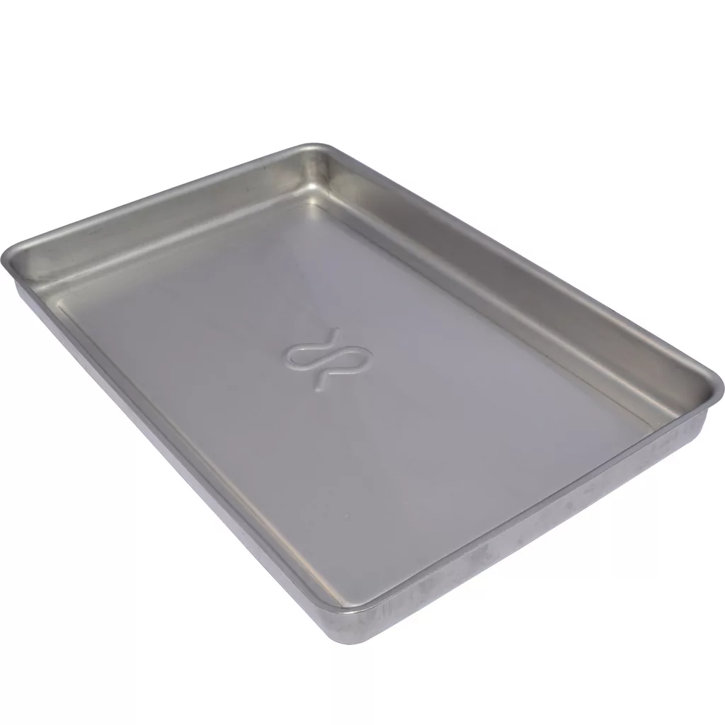 The Rancilio 32330365 Drip Tray is a rectangular, silver metal tray with slightly raised edges and a flat surface featuring a subtle embossed center design; shown empty and viewed at an angle. © 2025 1st-line.com