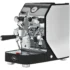 A modern Domobar Super espresso machine with a black and silver design, featuring flow control, multiple dials, levers, and a portafilter on a perforated metal drip tray. The VBM logo is visible on the front.