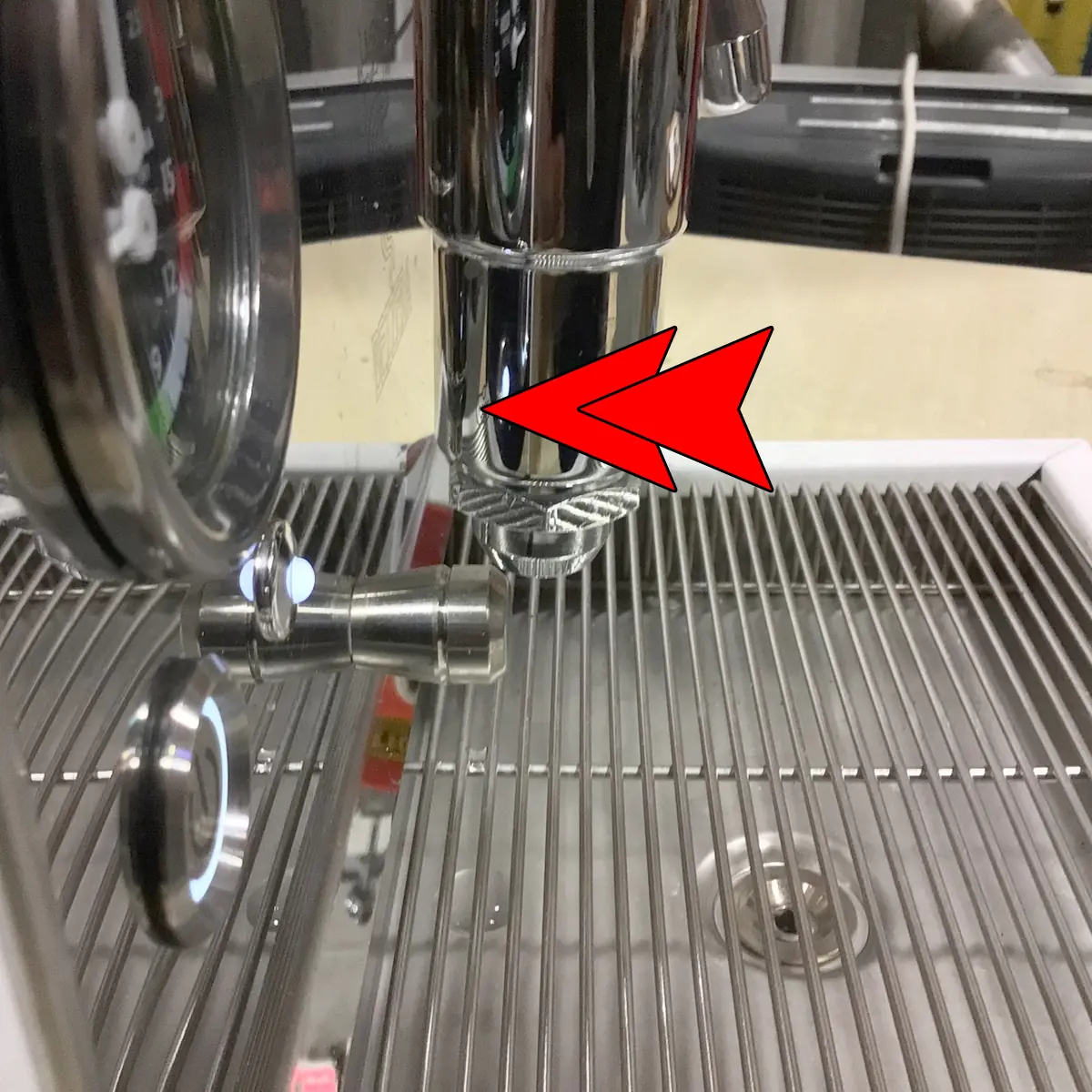 A close-up of the SOLD RETURNED & REFURBISHED - Bezzera Aria HX Special Edition Espresso Machine w/ Flow Control (C104) shows the group head with a red arrow pointing to the portafilter area, metal drip tray below, and side pressure gauge.