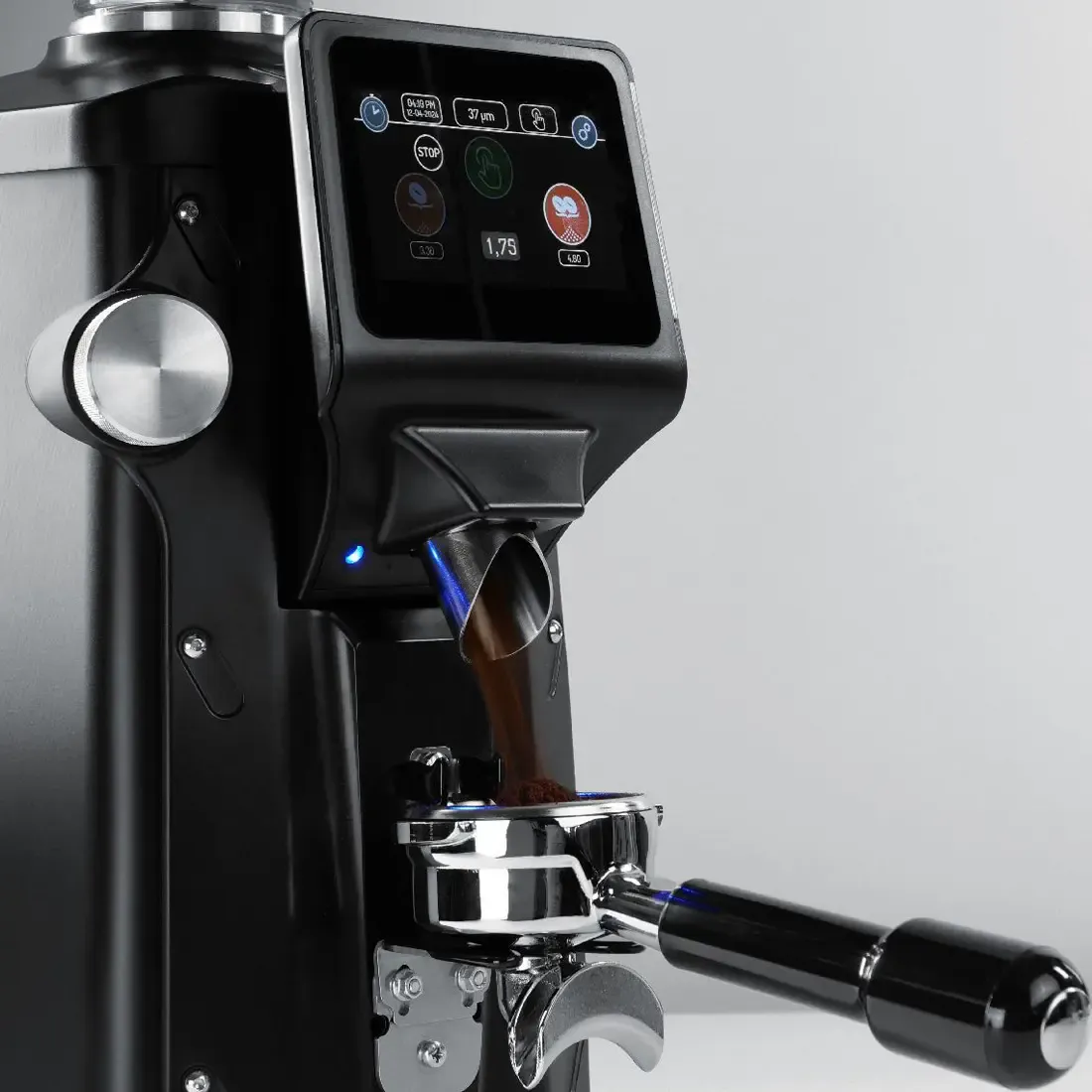 Quamar A01 65 Espresso Coffee Grinder with a close up of the display screen and ground coffee going into a portafilter