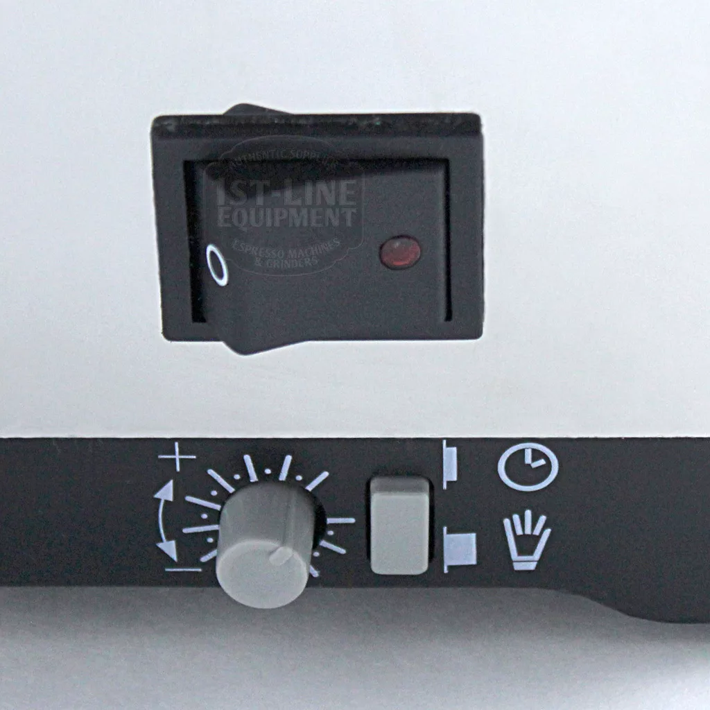 Close-up of a DISCONTINUED Eureka MCI Mignon Programmable Doserless Espresso Coffee Grinder control panel with a black power switch, red indicator light, dial with +/- symbols, gray slider, and three white icons for programmable settings. © 2025 1st-line.com