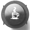 The V.4249 25mm DIAMETER LIGHT WATER SWITCH is a black car dashboard button featuring a white steaming cup icon, symbolizing the vehicles coffee break or heated cup function. © 2025 1st-line.com