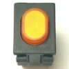 The V.4293 YELLOW PUSH SWITCH is a rectangular black plastic switch with a raised, oval yellow button featuring concentric grooves, shown from above on a white background. © 2025 1st-line.com