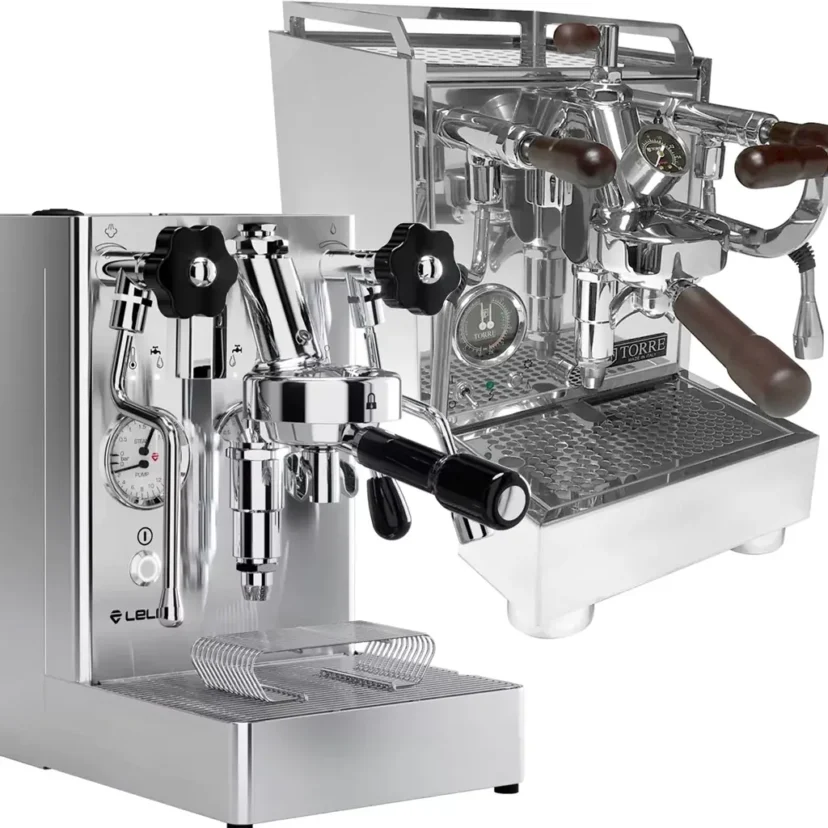 Two shiny, stainless steel espresso machines are shown. In the foreground is the modern Lelit Mara X V2 with a pressure gauge, while behind it sits the Torre Luigino TSP HX, featuring wooden handles and a vintage appearance.